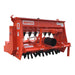 BEFCO Green-Rite Seeder and Aerator, red metallic finish with multiple seed drop tubes and wheels.