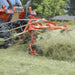 BEFCO Hay Tedder Rake DRP-300 angled view, orange with rotating tines for efficient hay spreading.