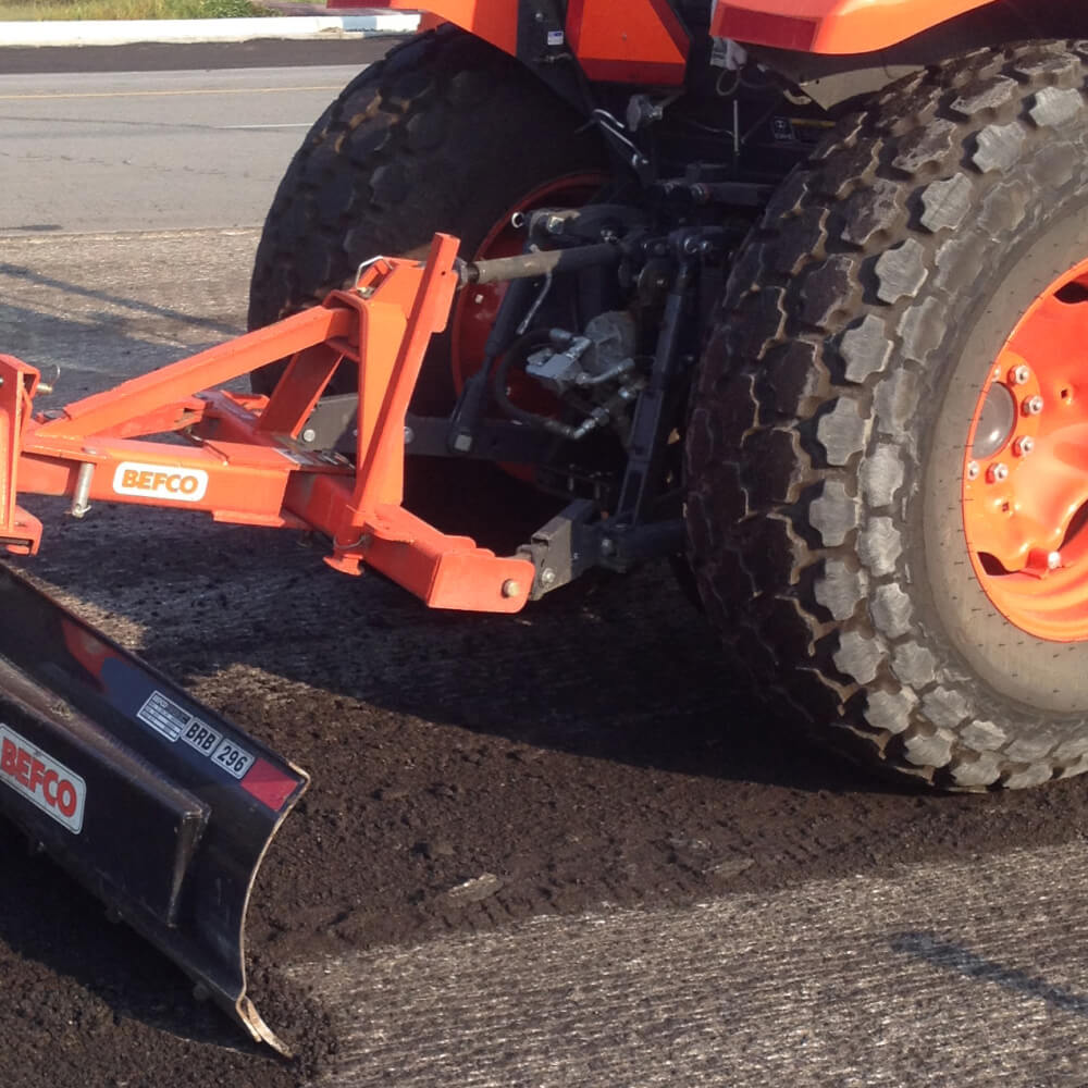 BEFCO Heavy Duty Rear Blade for Tractor, orange and black, angled view with adjustable blade.