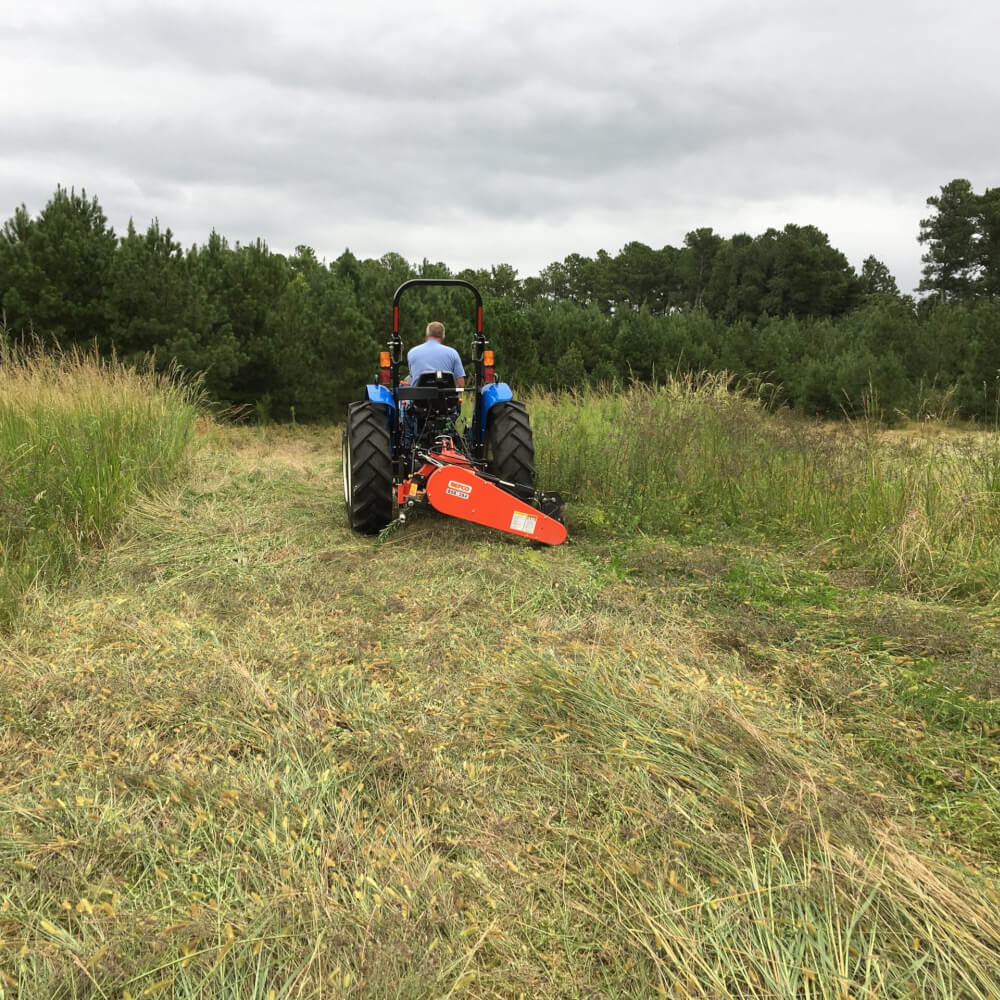 BEFCO Sickle Bar Mower angled view, orange attachment, robust design for efficient grass cutting.