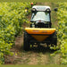 BEFCO Turbo Hop 303 Pendulum Spreader, yellow, angled view with large wheels for agricultural use.