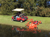 BEFCO Cyclone C30-CE5H grooming mower in orange, attached to a red golf cart, angled view.