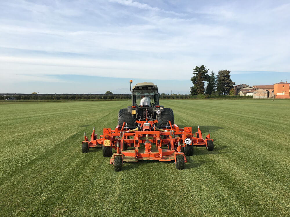 BEFCO Cyclone Super Flex Gang Grooming Mower, orange, rear view with wide cutting deck and wheels.
