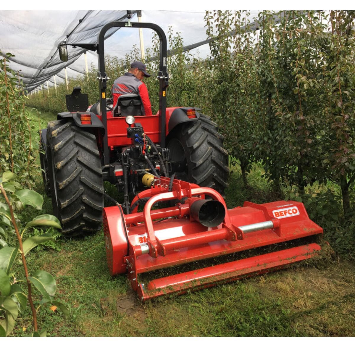 BEFCO Destroyer D90 Flail Shredder, red, angled view with robust wheels and cutting blades.