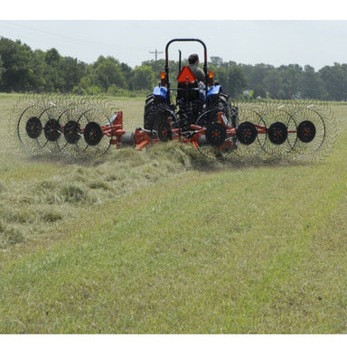 BEFCO Hay Rake rear view, red and black with multiple tine wheels for efficient hay raking.