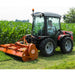 BEFCO Hurricane H70 Flail Mower, orange, angled view, mounted on tractor, cutting grass.