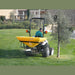 BEFCO Turbo Hop 303 Pendulum Spreader, yellow, rear view with large wheels for stability.