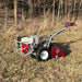 Brush Mower PD209HE Power Dog, red and gray, angled view with large wheels and engine.