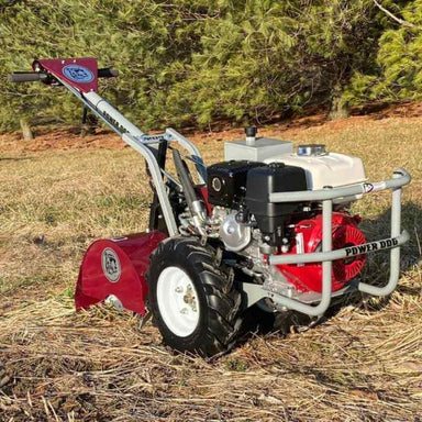 Brush Mower PD209HE Power Dog, red and gray with large wheels and an engine.
