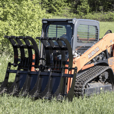 Dual Clamshell Grapple for Skid Steer by Prime Attachments, black, front view with raised tines.