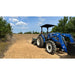 Firminator G3 with disks and cultipackers attached to a blue tractor on a farm.