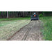 Firminator G3 - Disks and Cultipackers cultivating soil with visible tire tracks in a green landscape.