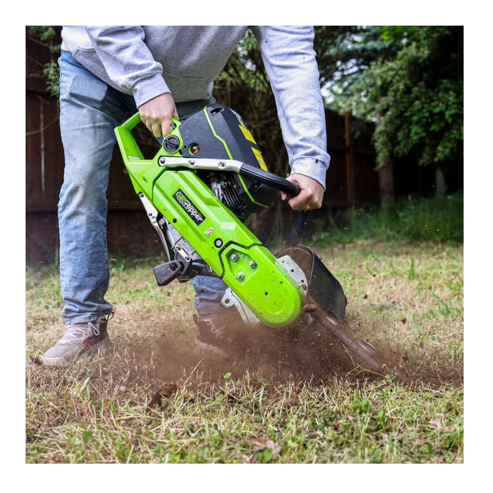 GeoRipper GR20 Trencher, green handheld design, angled view with cutting blade and debris action.