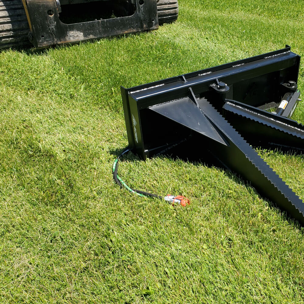 Glacier Stump Shark attachment in black, angled view with serrated edges and hydraulic connection.