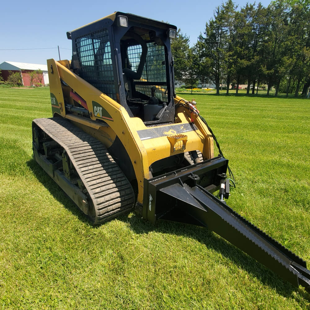 Glacier Stump Shark attachment for excavators, angled view with black cutting blade and yellow body.