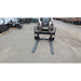 Glacier Attachments 5500 Lb Skid Steer Forks in front of a bobcat skid steer