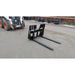 Glacier Attachments 5500 Lb Skid Steer Forks side view with Bobcat Skid Steer in background