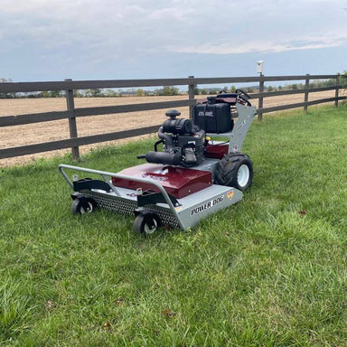 Grazer Brush Mower 24 HP Kawasaki in red and gray, angled view with large wheels and engine.