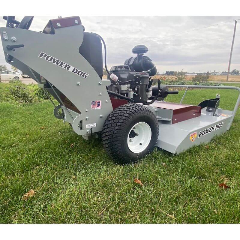 Grazer Brush Mower 24 HP Kawasaki in gray, side view with rear wheels and engine details.