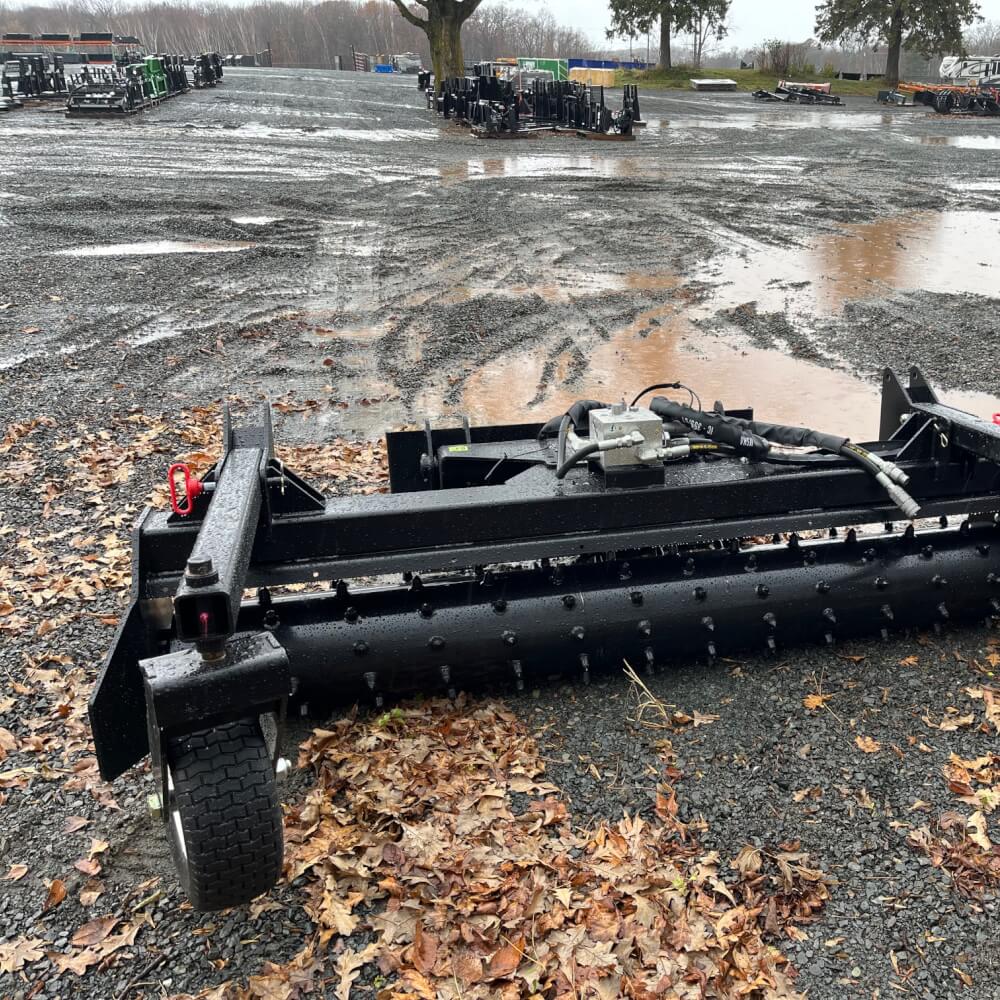 HD Soil Conditioner by Prime Attachments, black, angled view showing wheels and adjustable features.
