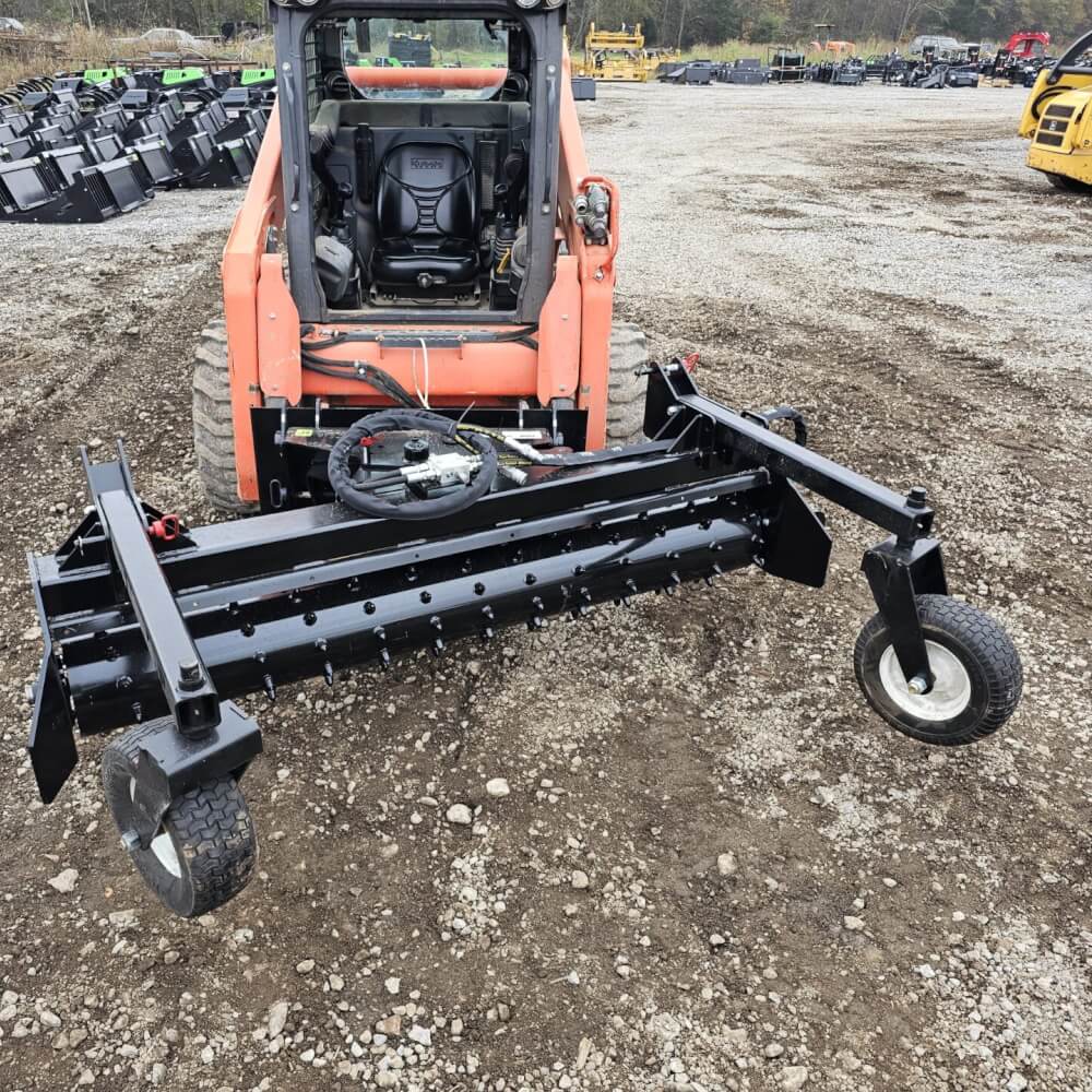 HD Soil Conditioner by Prime Attachments, black, front view, featuring wheels and adjustable components.