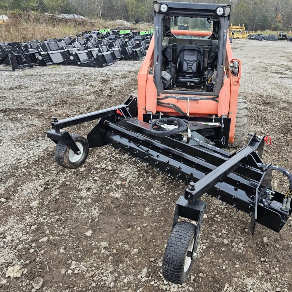 HD Soil Conditioner by Prime Attachments, front view, black with wheels and robust design.