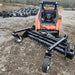 HD Soil Conditioner by Prime Attachments, front view, black with wheels and robust design.
