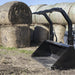 High Capacity Grapple Bucket by Prime Attachments, black, angled view, ideal for hay handling.