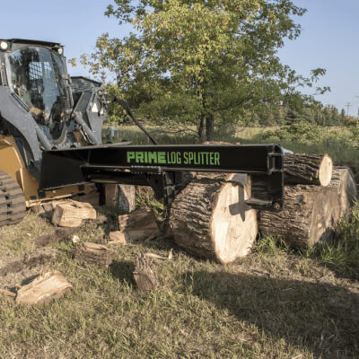Prime Attachments Inverted Log Splitter for Skid Steer, black with green logo, angled view.