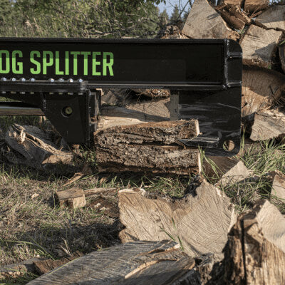 Inverted Log Splitter for Skid Steer, black with green lettering, angled view showing split logs.
