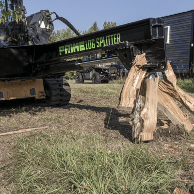 Inverted Log Splitter for Skid Steer by Prime Attachments, black with angled splitting mechanism.
