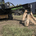 Inverted Log Splitter for Skid Steer by Prime Attachments, black with angled splitting mechanism.