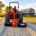 Person on tractor using the BEFCO 3 Point Rear Blade for their Tractor for their gravel driveway