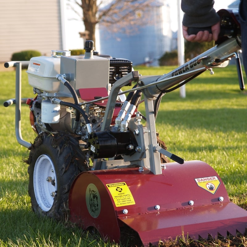 Power Dog 209 Commercial Tiller close up view being operated in the yard