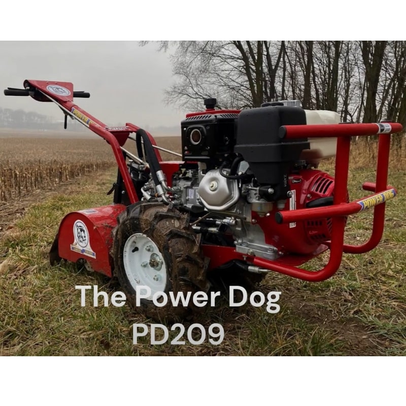 Power Dog 209 Commercial Tiller on grass field heavy-duty walk-behind tiller with Honda engine