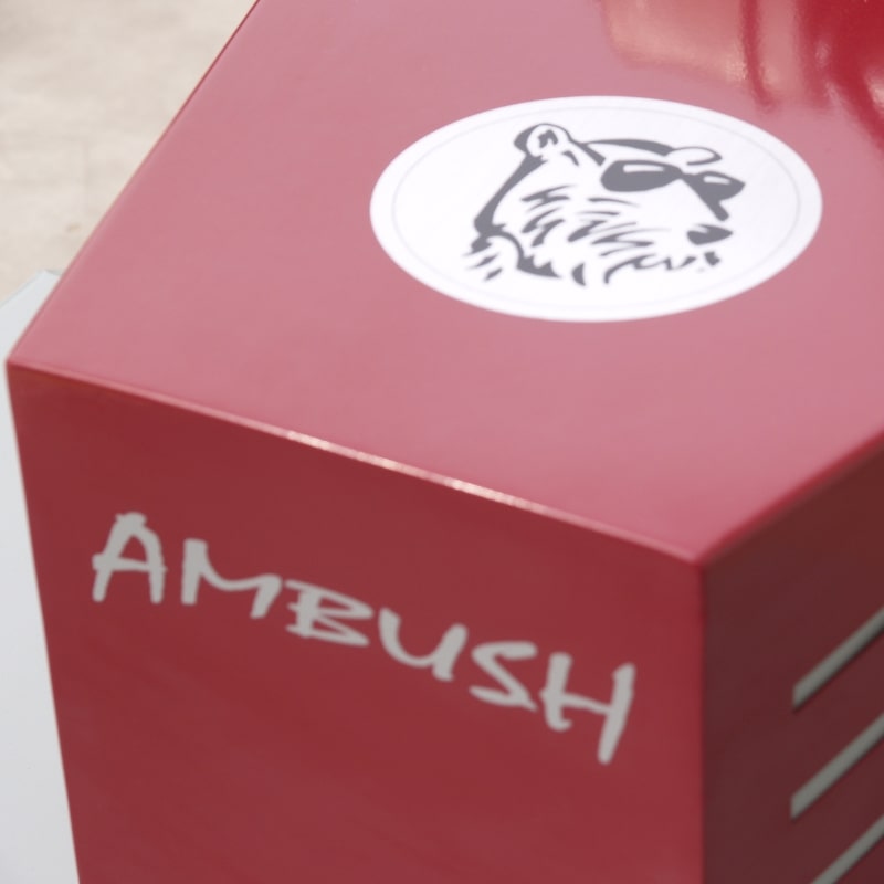 Power Dog Ambush 26″ Weed & Brush Mower close-up of logo on red engine cover