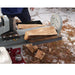Power Dog Quick Split log splitter splitting firewood, close-up of beam, wedge, and logs during operation.