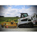 Roadrunner Skid Steer Grader Attachment, yellow with adjustable blade, mounted on a Bobcat.