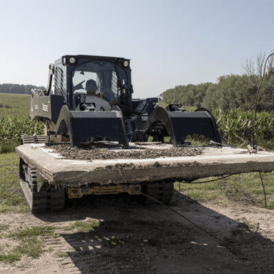 Rock and Brush Grapple by Prime Attachments, black, front view with wide flat base and claws.