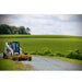 Skid Steer Grader Attachment by Roadrunner Equipment, yellow, angled view, designed for grading surfaces.