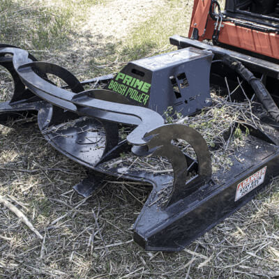 Skid Steer Mower Attachment by Prime Attachments, black with curved blades for efficient cutting.