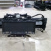 Skid Steer Soil Conditioner by Glacier Attachments, black front view with hydraulic hoses.