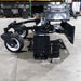 Skid Steer Soil Conditioner by Glacier Attachments, angled view, black with durable wheels and hydraulic features.