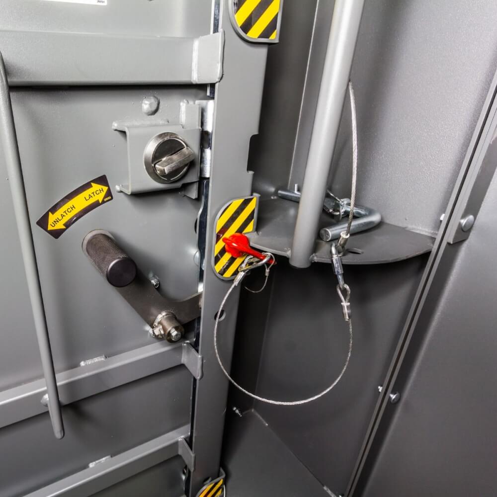 Swisher 14 Person ESP Safety Shelter detailed view, gray metal door latch and safety features.