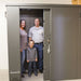Swisher 20 Person ESP Safety Shelter, gray, front view, secure door, spacious interior.