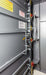 Swisher 20 Person ESP Safety Shelter interior view, gray panels with safety features and warning labels.