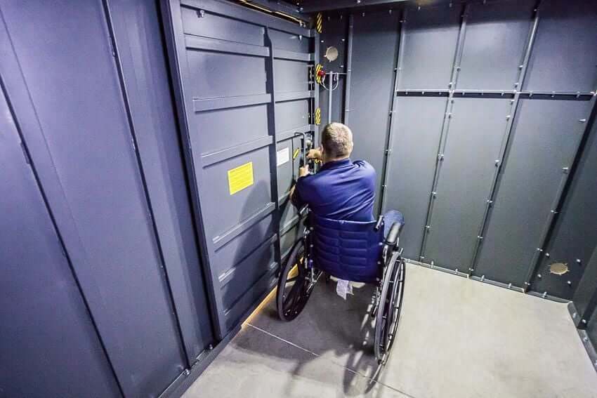 Swisher 20 Person ESP Wheelchair Accessible Storm Shelter interior view with accessible door controls.