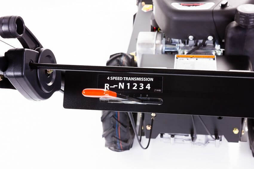 Swisher 24" walk behind rough cut mower, angled view showcasing 11.5HP engine and speed controls.