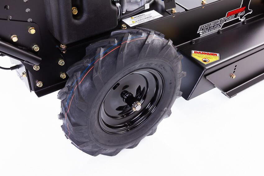 Swisher 24" Walk Behind Rough Cut Mower angled view, featuring robust black wheels and engine components.