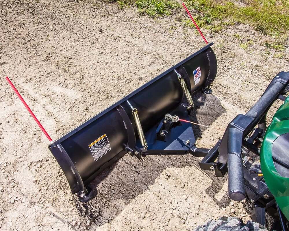 Swisher 2850 62" UTV plow blade, black with red markers, angled view showing attachments.